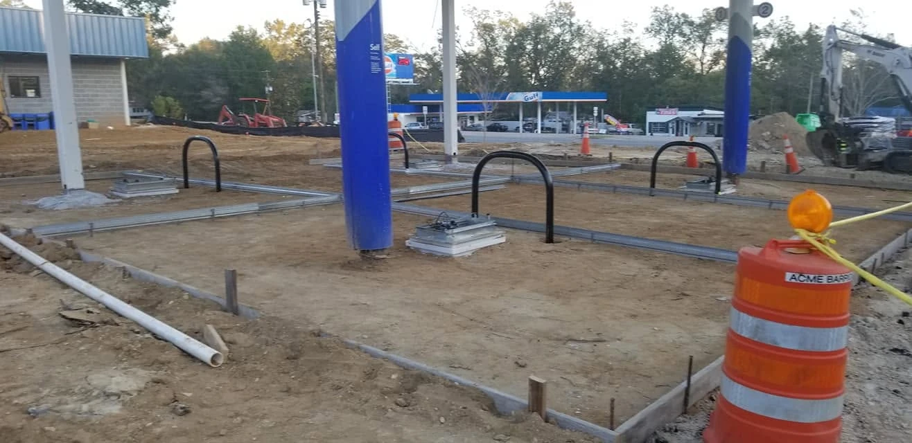 Dispenser island foundations and containment equipment during construction